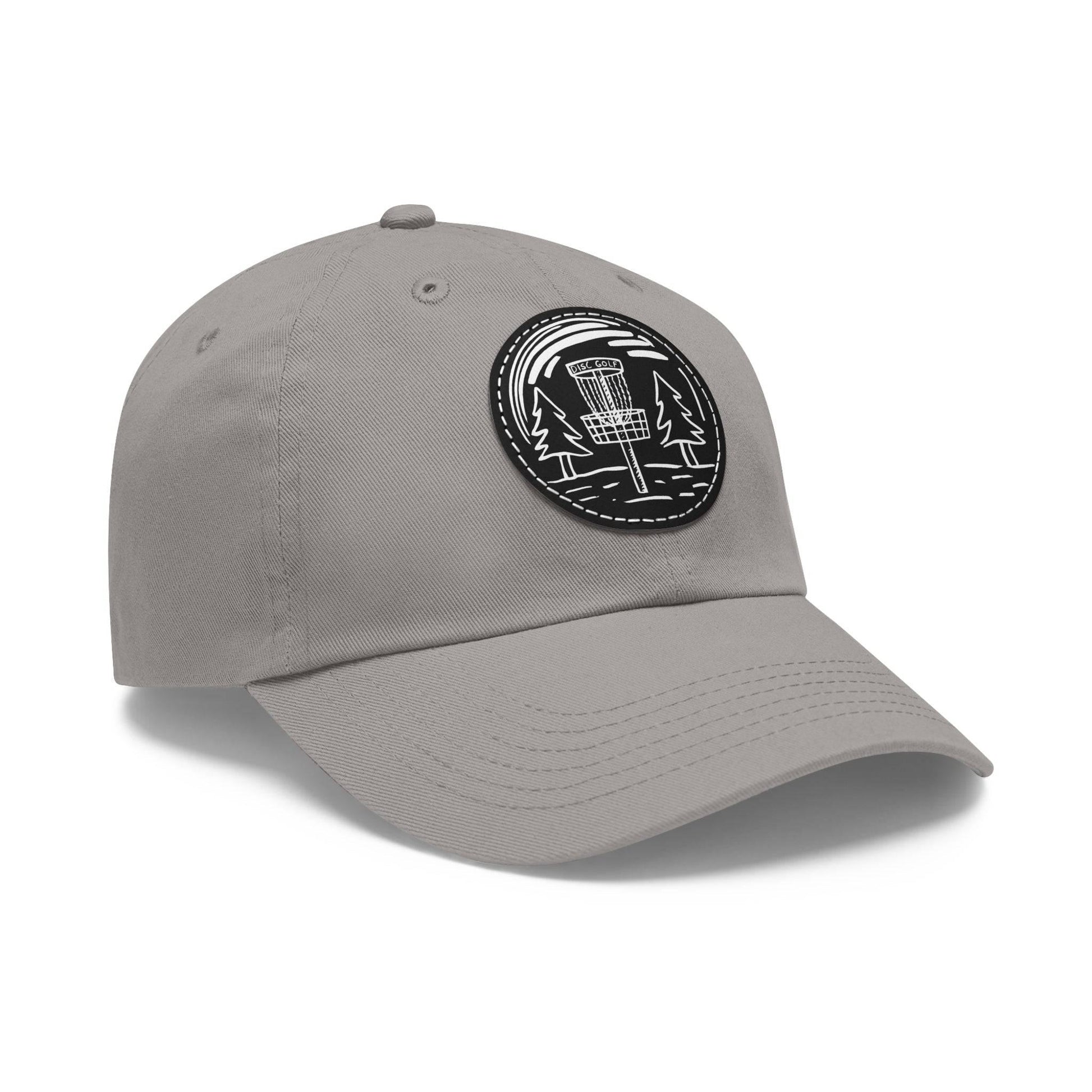 Fun Disc Golf Hat - Line Drawing of Trees and Disc Golf Basket - Dad Hat with Leather Patch (Round) - Quirky Goodies